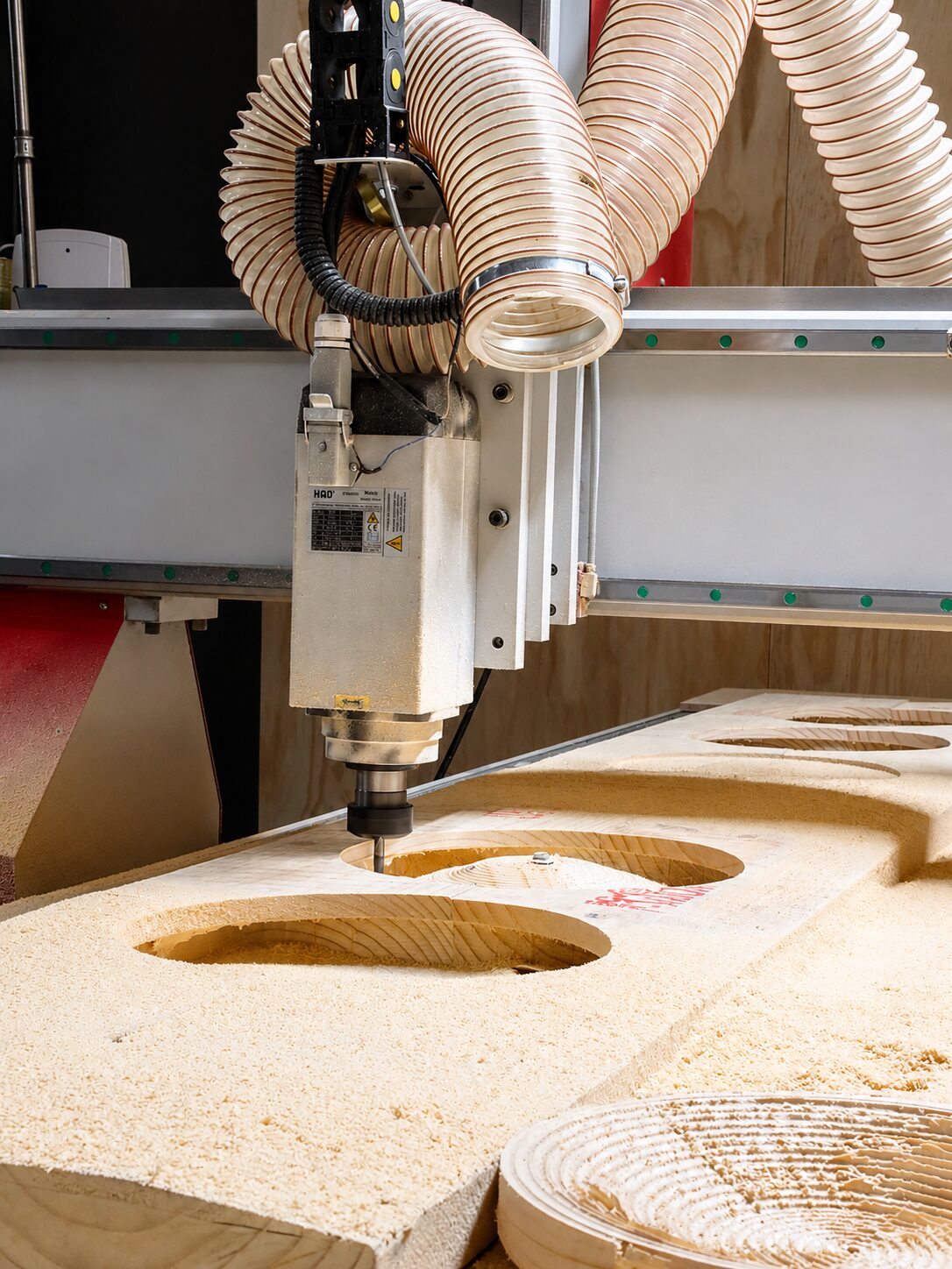 CNC router cutting a timber lighting fixture component in the Streamlight workshop